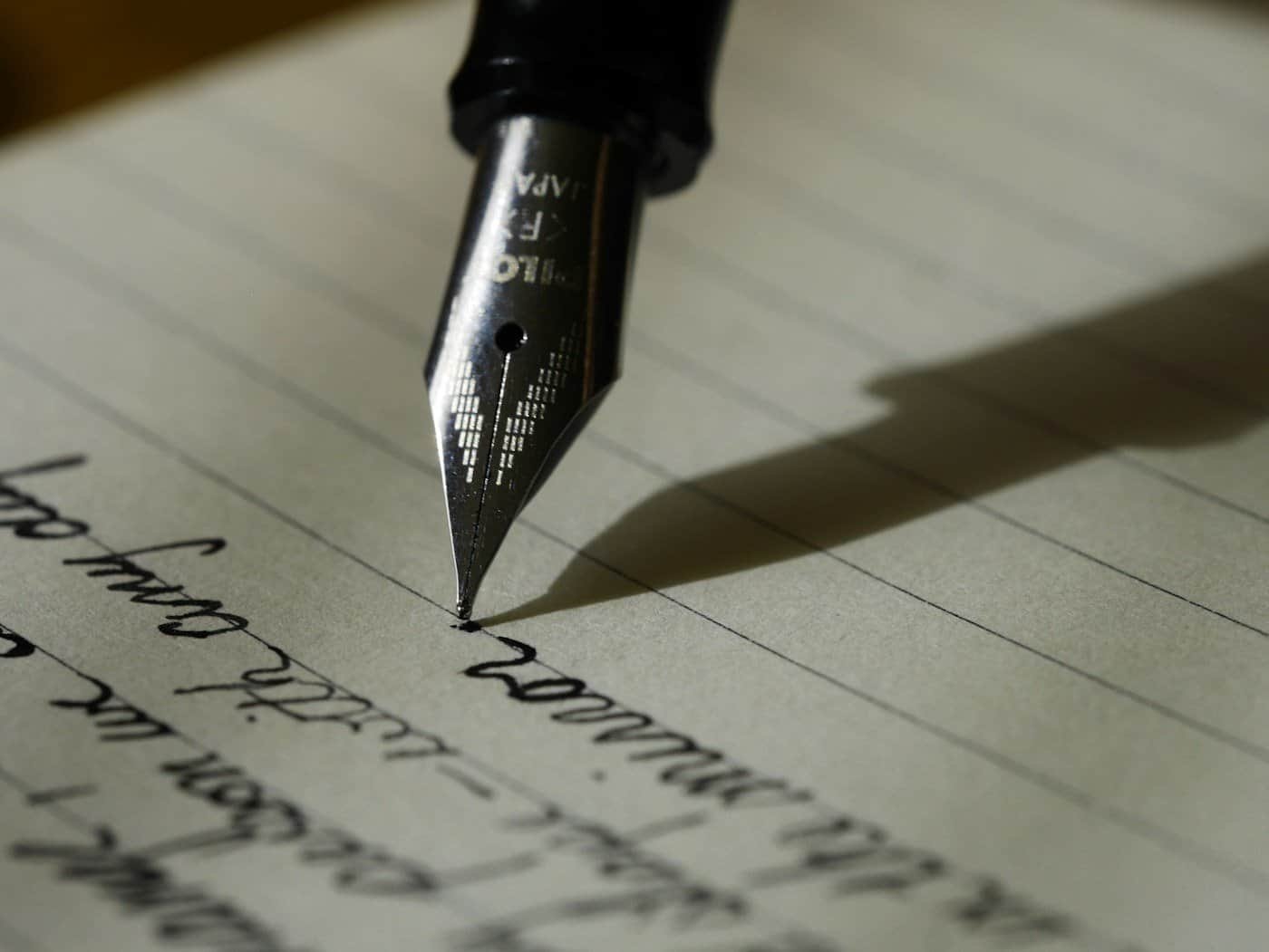 Writer working on a manuscript at a desk